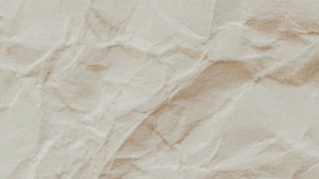 An animated background featuring textured overlay  of crumpled paper with wrinkles and folds, ending with the paper being folded from the top edge down