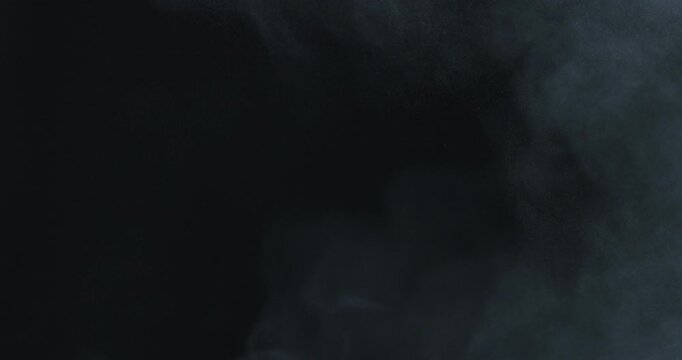 Fine powder dust exploding into soft airborne particles in slow motion, creating a smooth, dreamy texture. Ideal for backgrounds, overlays, and creative visual effects