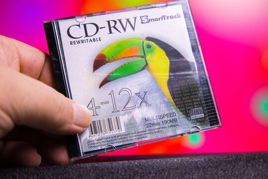 SmartTrack CD-RW with toucan design held in hand featuring rewritable disc technology for data storage