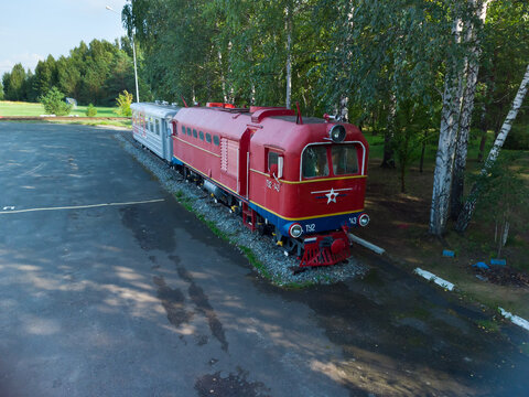 Borovskiy, Russia - August 6, 2021: Outdoor documentary photo of a preserved TU2 series narrow-gauge diesel locomotive (number TU2-143) displayed as a monument at the Malaya Tyumenskaya (Tyumen