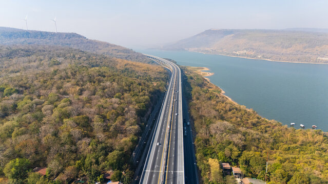 Drone shot aerial view landscape of the M6  motorway Expressway Nakhon Ratchasima Province - Bang Pa-in. Lam Ta Khong River and Mountain. Drone shot of scenic landscape rural place traffic
