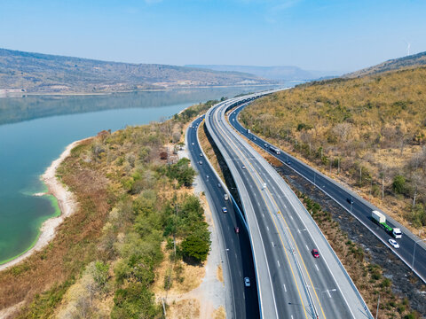 Drone shot aerial view landscape of the M6  motorway Expressway Nakhon Ratchasima Province - Bang Pa-in. Lam Ta Khong River and Mountain. Drone shot of scenic landscape rural place traffic
