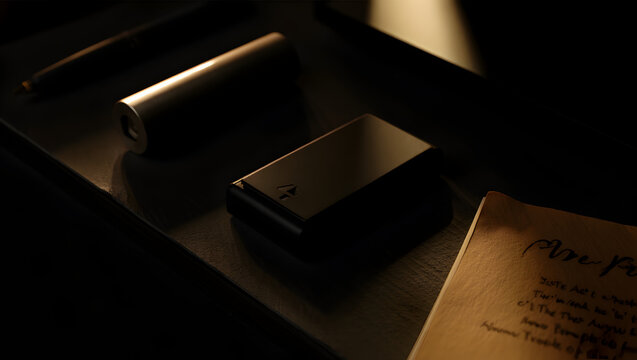 Modern devices next to vintage notebook