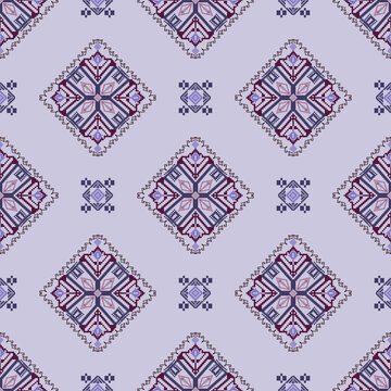 Seamless cross-stitch vector pattern. Colorful ethnic ornament. Arabesque pattern style. Pixel vector pattern. Wallpapers, tiles, and textiles.