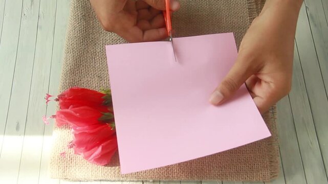 Blank paper or empty space for writing, flat-lay photograph features a vibrant arrangement of Turk's Cap flowers, scientifically known as Malvaviscus arboreus