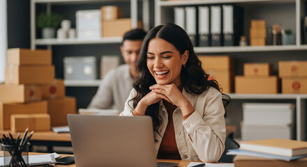 Obraz premium Smiling female entrepreneur managing online orders with laptop perfect for running successful ecommerce retail store and handling small business logistics