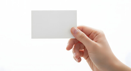 Obraz premium A hand holding a blank white card on a plain background