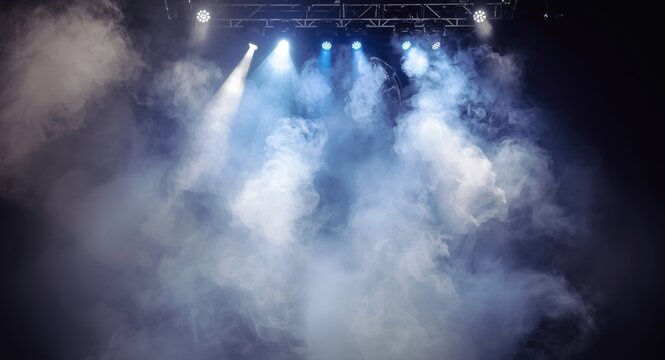 Stage fog effects created by dry ice and electric smoke machine in theatrical lighting