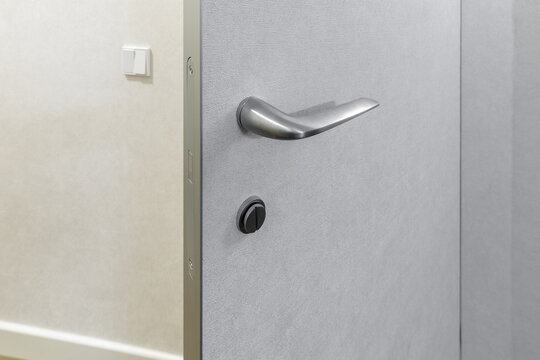 Modern Silver Door Handle without Rosette on Textured Grey Panel