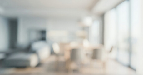 Fototapeta premium A blurred interior view of a modern living room and dining area, showcasing large windows and soft furnishings in a spacious, bright environment.