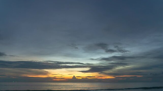 time lapse Clouds are moving slowly in the sky during sunset at Karon beach Phuket.video 4K.Nature video High quality footage 
Scene of Colorful romantic sky sunset with cloud in the sky background.