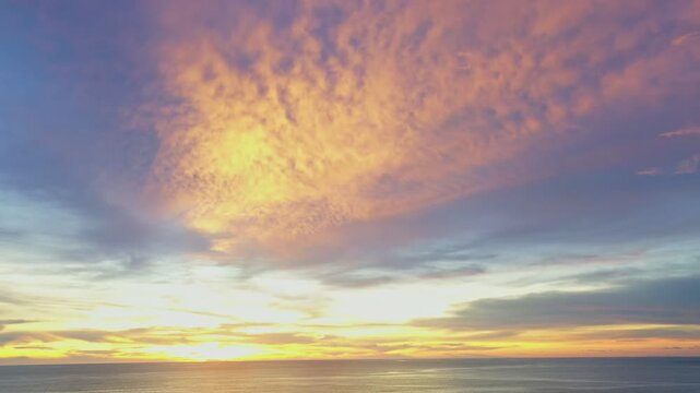 aerial view wave after wave swept towards the shore. 
Landscapes view of beach sea sand and wave in sunset. 
Beach sea space area. Blue sea, waves crashing at Karon Beach, Phuket Thailand.