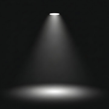 A spotlight shining down on a dark background.