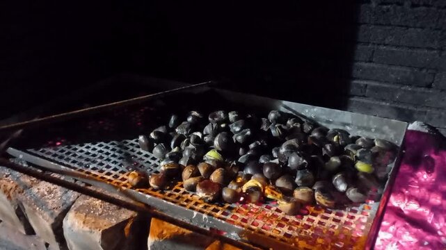 Roasting chestnuts over the embers of a fire