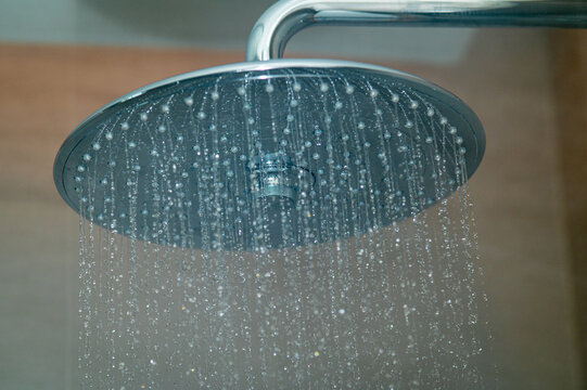 Rain Shower Head with Water Spraying in Modern Luxury Bathroom
