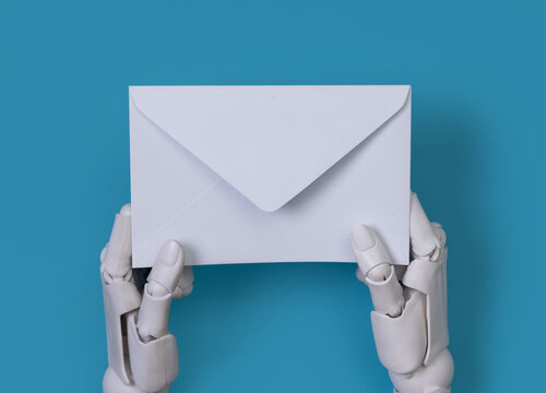 Robotic Hands Holding a White Envelope on Blue Background for Email Concept