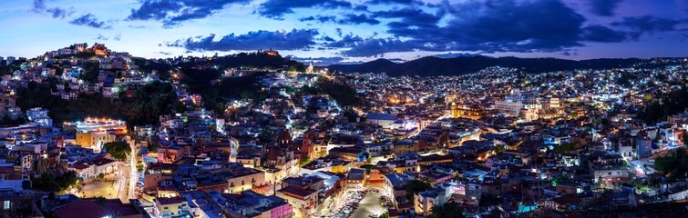 Fototapeta premium Panoramic view of the colorful cityscape of Guanajuato, Mexico at night