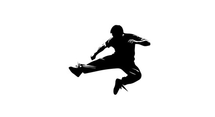 Obraz premium Silhouette of a man performing a dynamic kick action in mid-air with kung