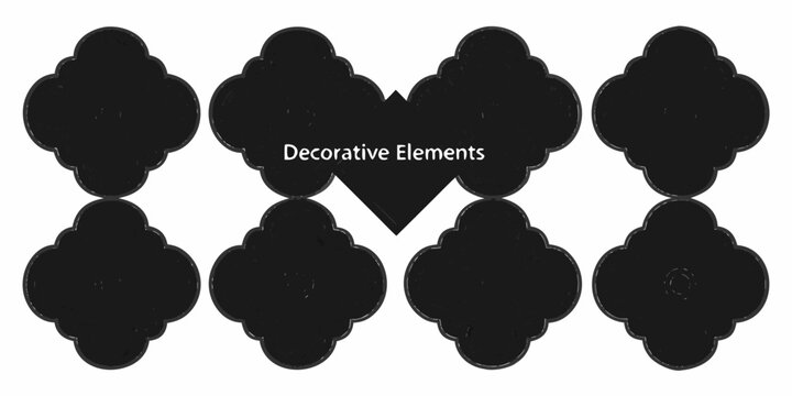 Black decorative elements arranged in a symmetrical floral inspired pattern