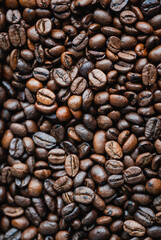 Fototapeta premium Top view close up of frame filled with roasted coffee beans.