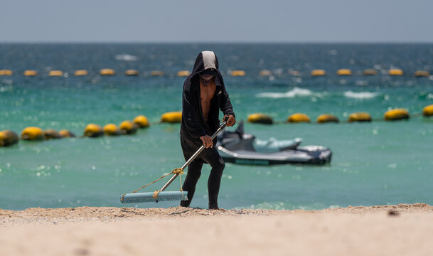 Beach Comber on Beach Koh Larn Thailand