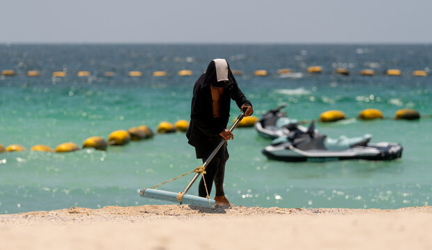 Beach Comber on Beach Koh Larn Thailand