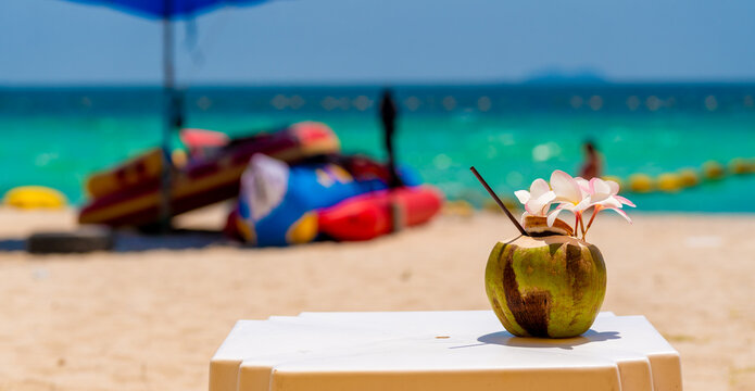 Fresh Coconut on Beach side Table in Thailand