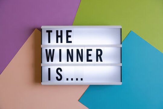 The winner is cinematic light box on colorful geometric background