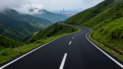 Fototapeta premium Winding Road Through Lush Green Hills with City Skyline