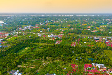 Aerial view of Phu Son village of bougainvillea blooms throughout Ben Tre, Vietnam © CravenA