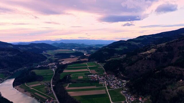 Drone flyover farmland river village