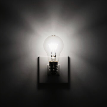 Surreal Lightbulb Emitting Shadows Instead of Light