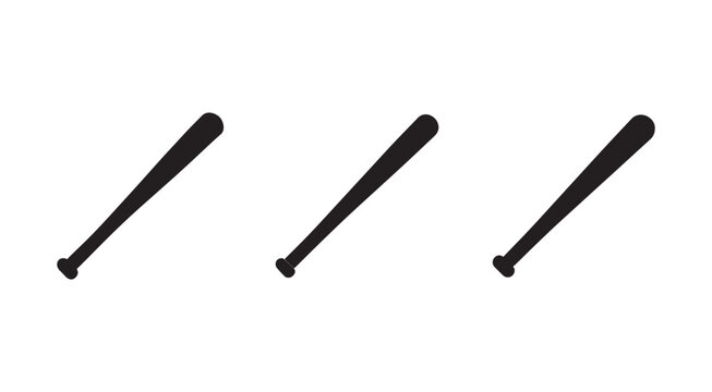 Three baseball bats lying on a surface in different positions  sports equipment