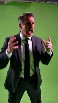 White middle aged businessman on green screen throws both hands up in outrage and shouts in anger for conflict blame crisis frustration or dramatic workplace reaction scenes businessman