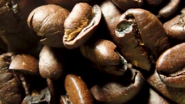 Macro shot of roasted dark brown coffee beans texture