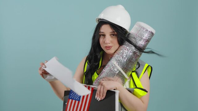 Female architect holding building plans and usa flag