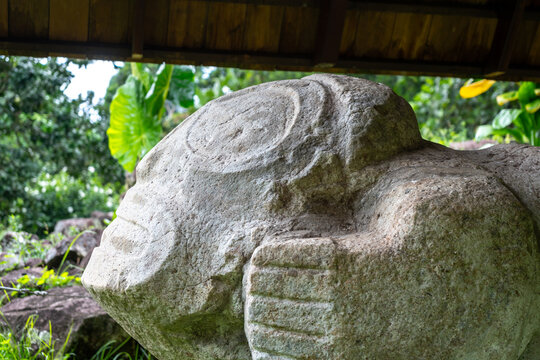 Stone sculpture of a birthing woman at Te Lipona, Hiva Oa, French Polynesia