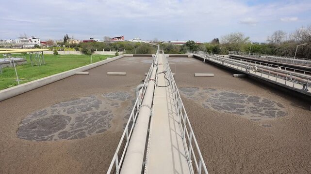 Secondary Treatment Stage: Activated Sludge Process in a Municipal Wastewater Treatment Plant. Biological Aeration Tank with Active Biomass and Sludge in a Sewage Treatment Facility	
