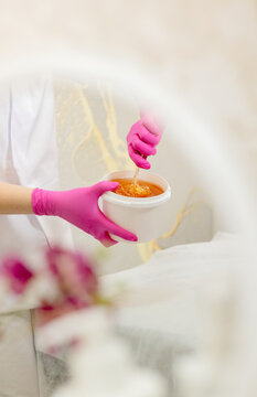 Woman Preparing Sugar Paste for Sugaring Hair Removal Procedure