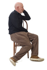 Side view of a man sitting asleep in a chair © Curto