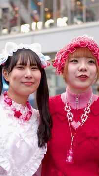 Two Young Women in Colorful Decora Fashion Taking Selfies in Tokyo