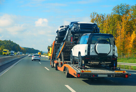 Transport of new all-wheel drive cars on a car transporter, transit through Germany.