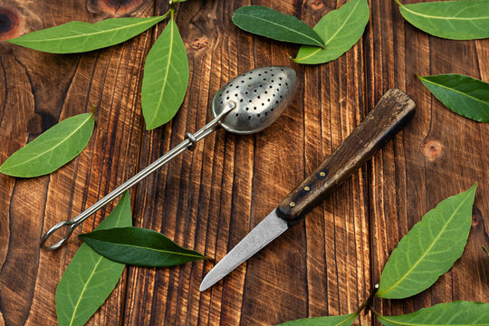 Bay leaf herbal tea preparation concept on a wooden surface