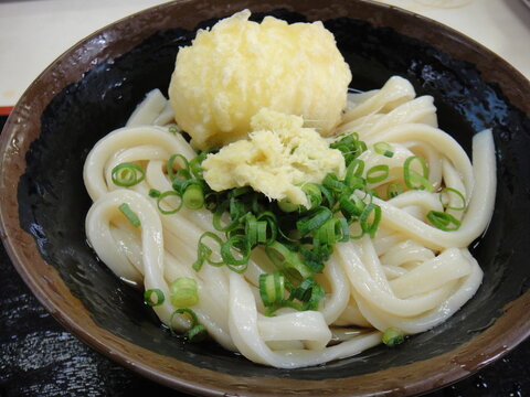 Authentic Sanuki Udon noodles, chilled Bukkake style topped with soft-boiled egg tempura, ginger, and scallions.