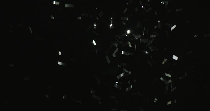 Side view and Slow motion of Multi colored Confetti explosion on black background