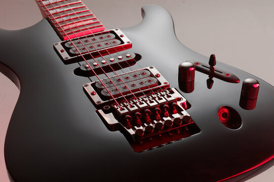 black gloss electric guitar with colored mirror, rock style
