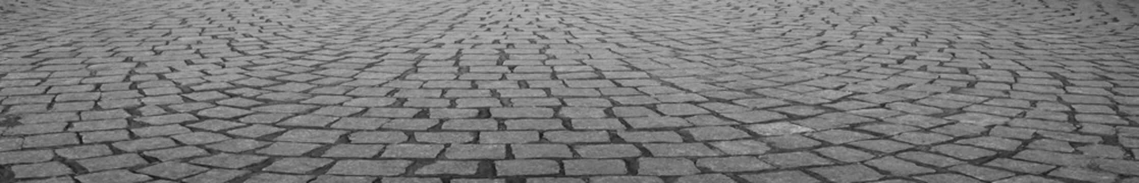 Old square cobble stone paving perspective background square tile flooring in perspective stones. city park tiled floor. Clinker paving stones. prospect view. Background. Texture. cube rock shape.