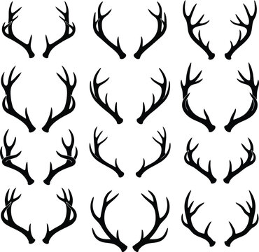Collection of diverse black deer antlers silhouetted against a white background showcasing various sizes and shapes