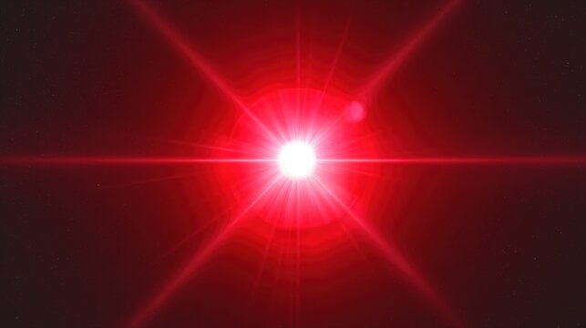 A bright red light shines in the dark with a lens flare effect