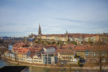 Fototapeta premium Bern, capital city of Switzerland, general perspective of the old city and the Schwarzes Quartier on the banks of the Aare river. 